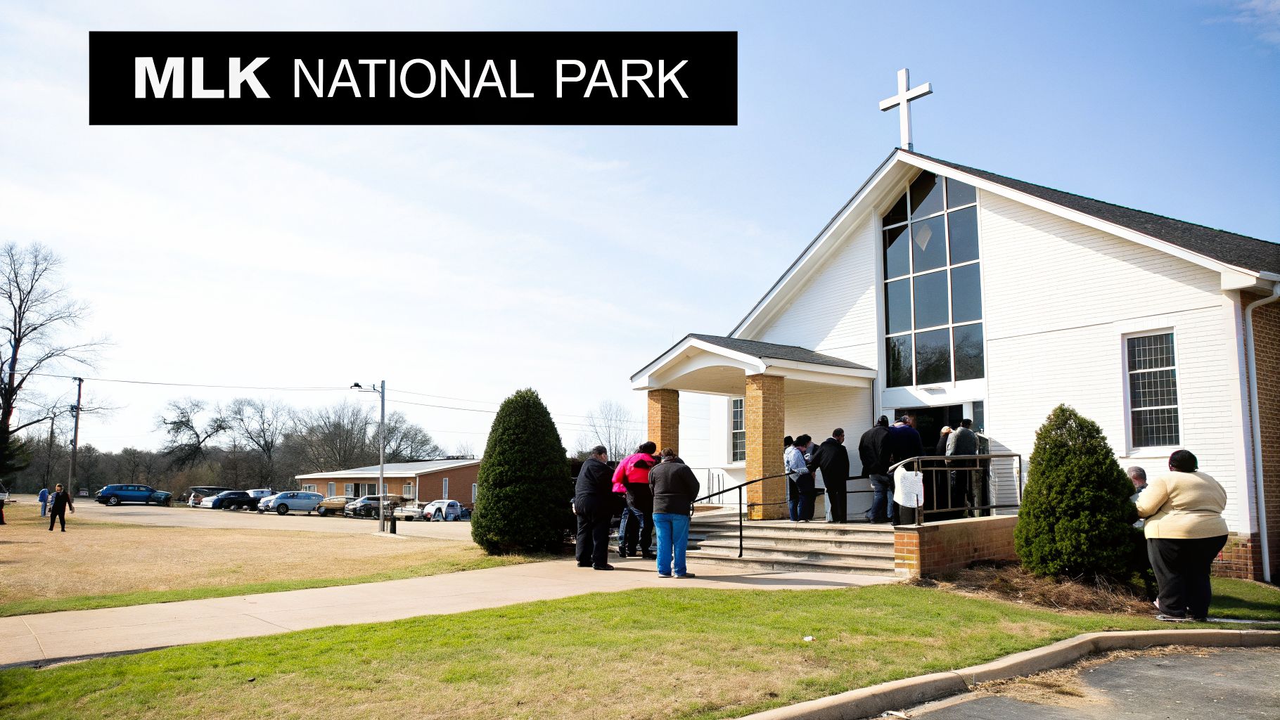 People walking and cycling on the Atlanta BeltLine trail on a sunny day.